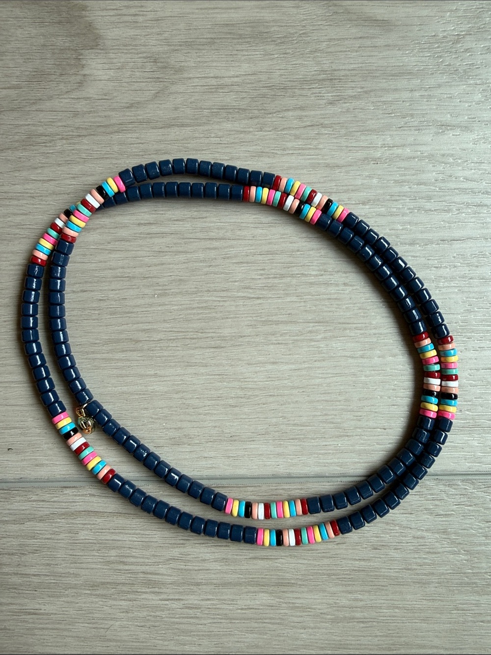 Caryn Lawn navy blue and multi-colored elastic beaded necklace